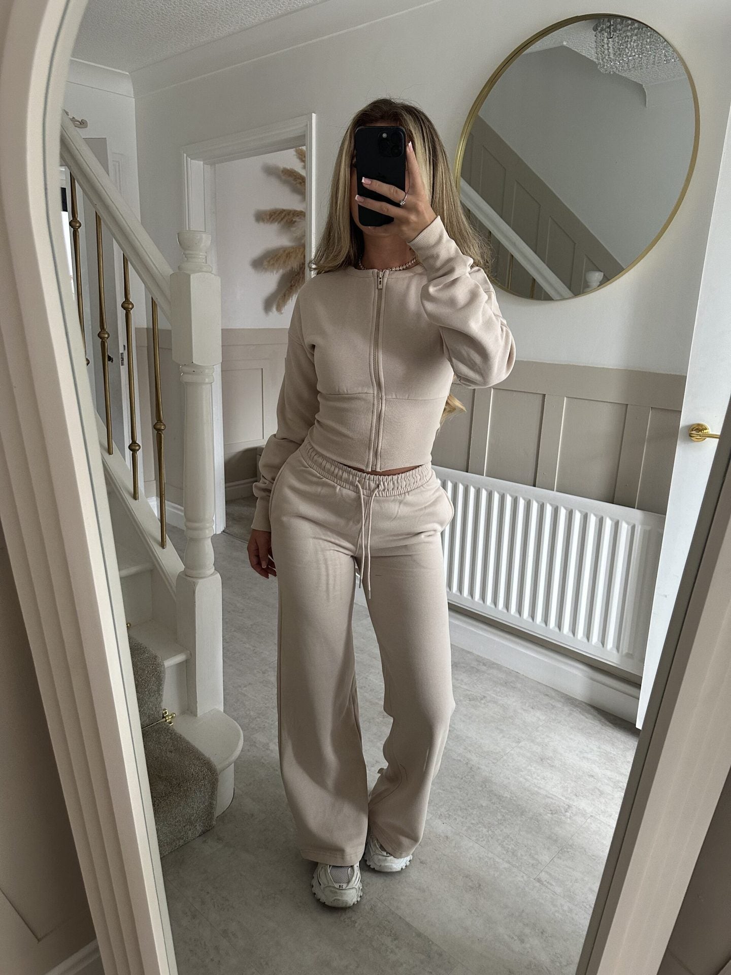 Womens two piece lounge set, a front zip jacket and straight leg drawstring pants in a soft sweat knit