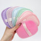 Reusable makeup remover pad with a satin hand strap shown on a plain background