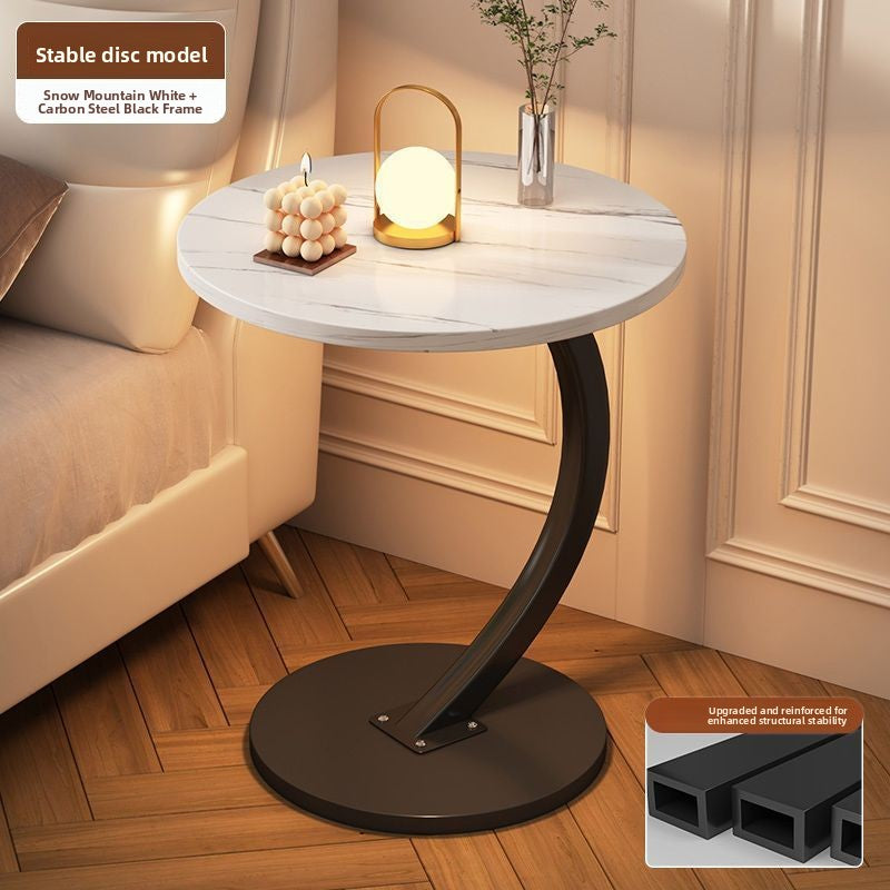 Snow mountain white veined round top side table with a black steel C frame and disc base, option Snow Mountain White