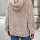 Plush jacquard hooded sweatshirt worn as a relaxed cool-weather layer