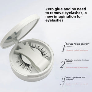 Magnetic false eyelashes in an open round white compact with a mirror lid