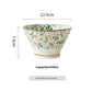 Close view of the underglaze green leaf and orange bud pattern