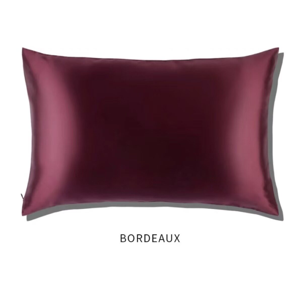 Bordeaux wine red slip glossy silk pillowcase on a white background