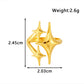 Gold star ring with maker chart marking 2.45 by 2.03 cm and 2.6 grams