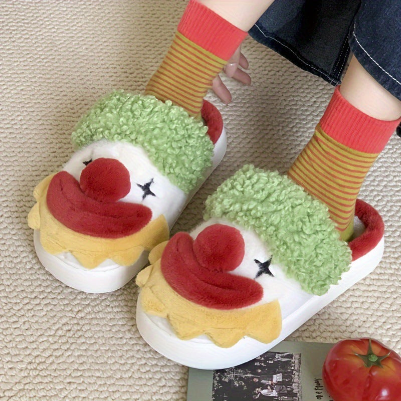 Pair of white plush slippers with green curly fur strap, red pom nose and yellow ruffle collar worn with striped socks