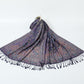 Indigo violet paisley jacquard scarf with a floral border, spread on white with navy tassel fringe