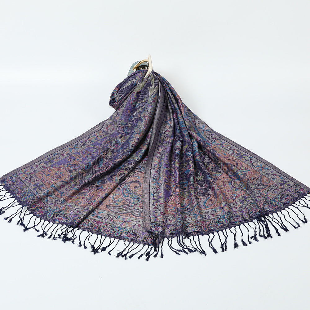Indigo violet paisley jacquard scarf with a floral border, spread on white with navy tassel fringe