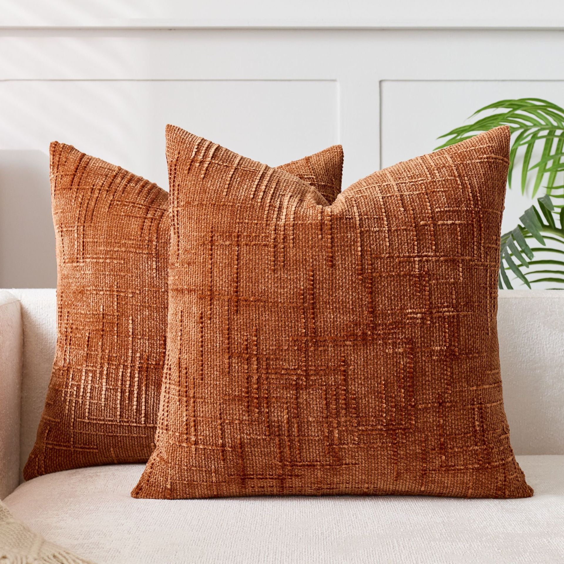 Soft chenille pillow cover in a single solid tone, its tufted crosshatch weave catching the light on the surface