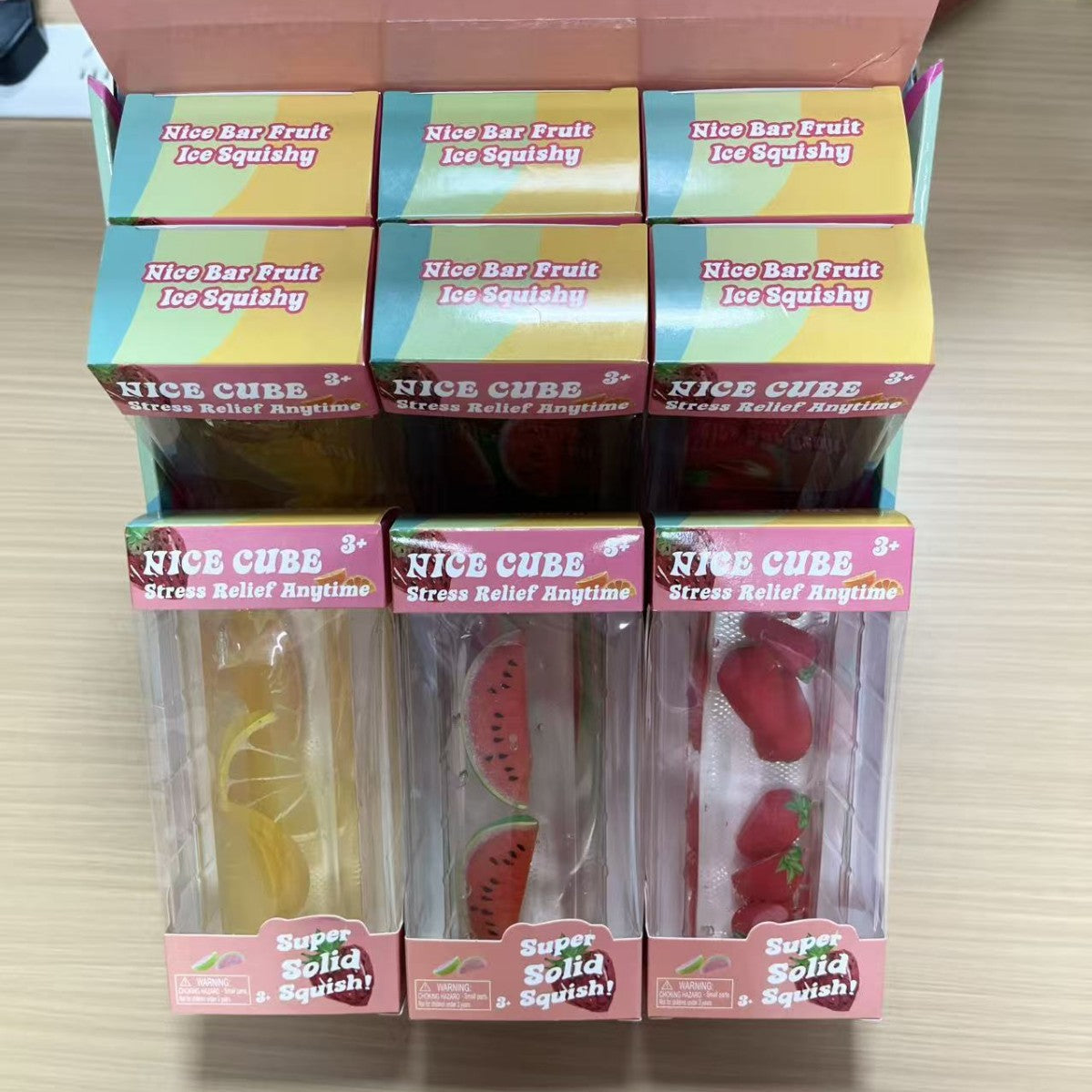 Fruit ice cube squishy toy showing peach style with pink fruit inside