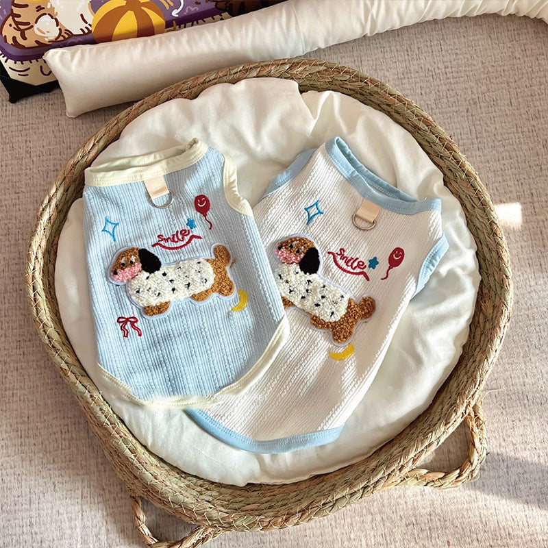 Sleeveless small dog vest with a back leash D-ring and a dachshund applique close up on the fluffy dachshund applique