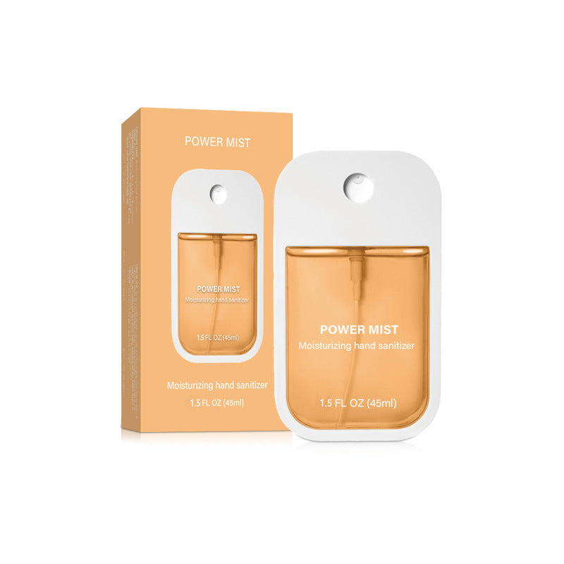 Amber orange pumpkin POWER MIST paper box and matching flat 45 ml hand spray on a white background