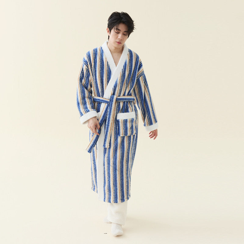 Man in a sky blue striped fleece kimono style robe with white collar, white cuffs and white patch pockets