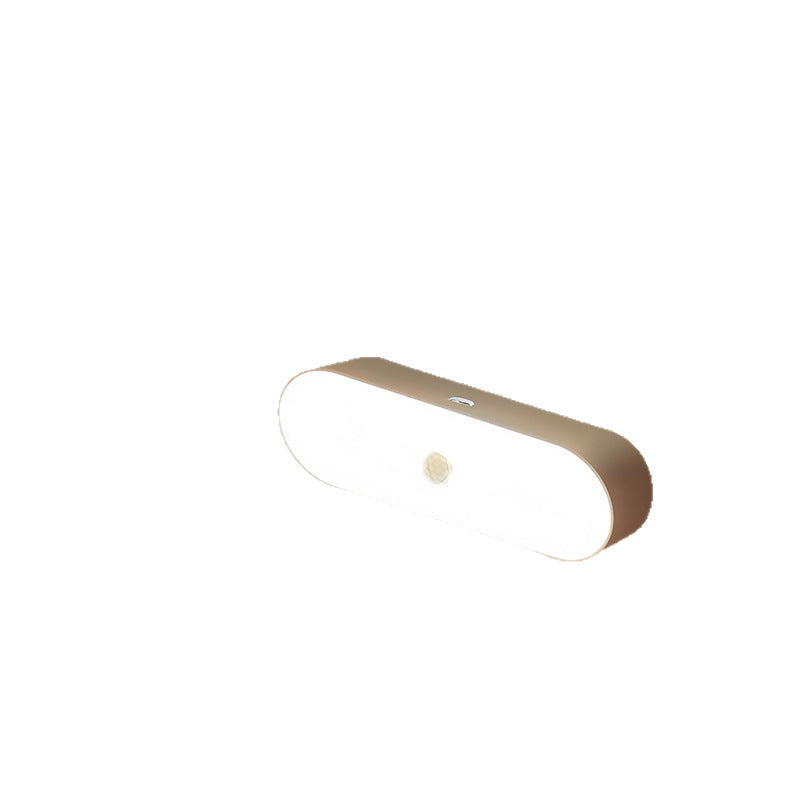 Oval LED motion sensor night light shown against a plain white background