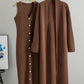Brown ribbed knit dress and matching long cardigan displayed together on wooden hangers