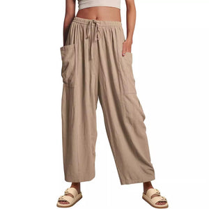 White pleated straight leg pants with elastic waistband