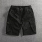 Men's cargo shorts shown flat with a part elasticated drawstring waist and a button fly