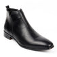Single black square toe ankle boot with a side seam, a low heel and a heel pull tab on white