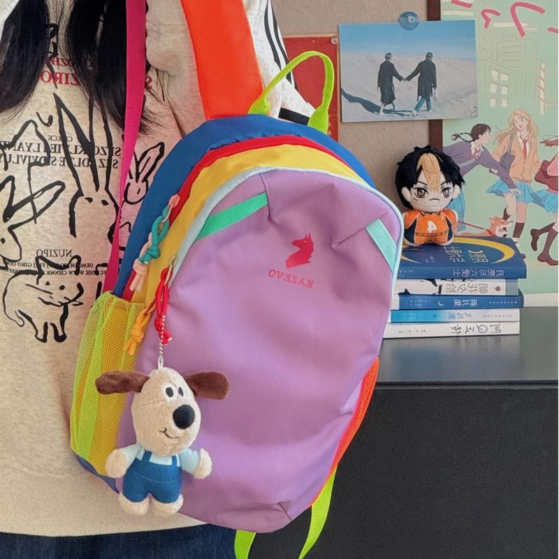 Light purple color block backpack front view, contrast shoulder straps and mesh side pocket for a bottle