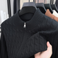 Black thick cable knit half zip sweater with a stand collar and neck zip