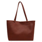 Brown PU tote bag on a white background with two slim handles, an open top and a pebbled surface
