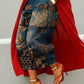 Wide leg cropped deep teal denim jeans with gold ornate medallion print, red coat and heels