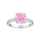 Round cut pink simulated diamond stone raised on four prongs above a smooth sterling silver shank