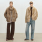 Faux fur coat in a cream shade, showing the uneven smudged dye through the long pile