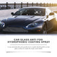 Dark sports car on a promenade under a maker panel naming the glass coating spray