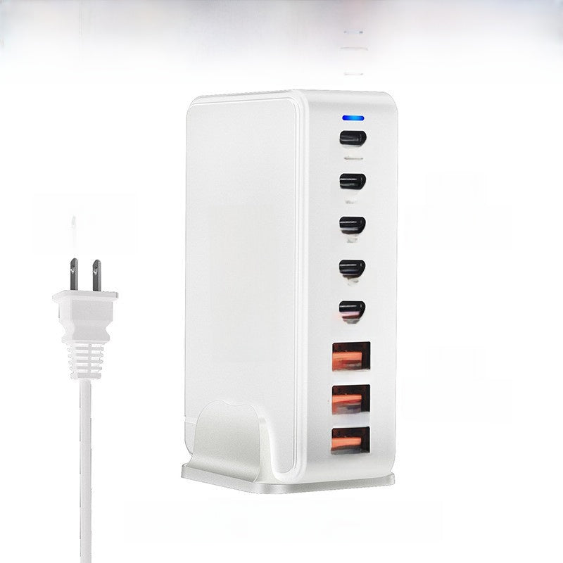 Multi port GaN charger shown with its regional power plug and detachable phone stand