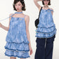 Front view of blue and white plaid pinafore with lace trim at the hem