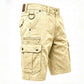 Washed cotton denim mens cargo shorts, detail of the plain hem just above the knee