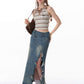 Skirt paired with ankle boots and a silk camisole for an evening look