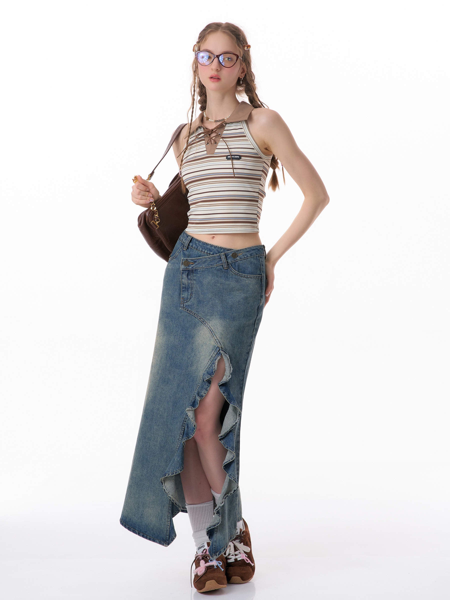 Skirt paired with ankle boots and a silk camisole for an evening look