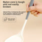 Gray and white silicone turner held by the handle showing the two tone nylon core grip