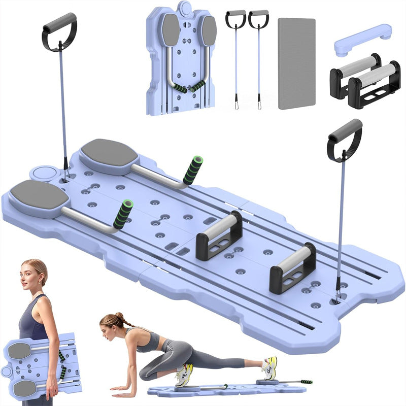 Ab wheel beside a yoga mat and a water bottle on the floor