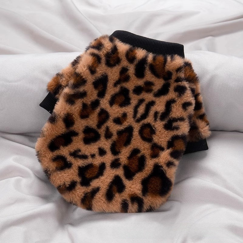 Leopard print pet sweater with black ribbed hem and cuffs, flat lay