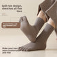 Man wearing taupe five-finger socks with a split toe and ribbed cuff beside a printed split-toe note