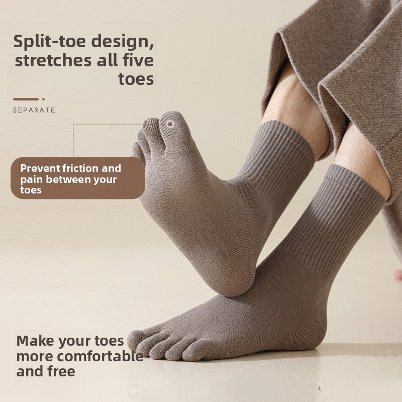 Man wearing taupe five-finger socks with a split toe and ribbed cuff beside a printed split-toe note