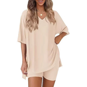 Milk silk V neck loungewear set, oversized short sleeve top and matching shorts on a model