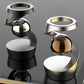 Floating bead spinning above the base of a magnetic levitation desk toy