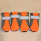 Two mesh dog shoes stacked to compare the mesh upper and rubber grip sole