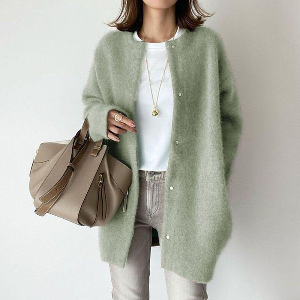 Knit cardigan styled in a warm evening setting over a dress