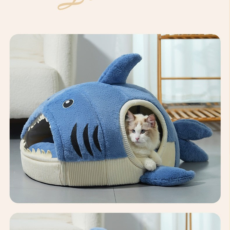 Blue shark nest pet bed with cream ribbed base and a cat looking out of the side opening