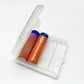 Two orange USB-C rechargeable lithium batteries in a clear case, the 2 pack option