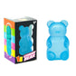 Blue gummy bear squishy toy beside its printed 3+ box
