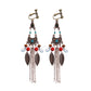 Handmade bohemian clip-on earrings with tassel and bead drop detail, zinc alloy frame, studio shot on white background