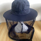 Nylon boonie sun hat with a cinchable mesh insect net around the brim