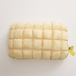 Pale yellow slow rebound bed pillow seen from above, box quilted
