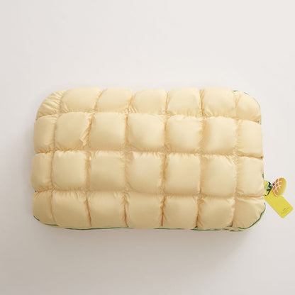 Pale yellow slow rebound bed pillow seen from above, box quilted
