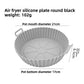 Round silicone air fryer liner tray with a fluted wall and spoked base, about 21 cm across